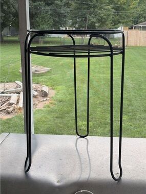 Black metal plant stand holder with legs